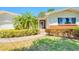Welcoming front exterior with brick accents and lush landscaping at 775 S Bayshore Blvd, Safety Harbor, FL 34695