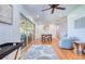 Living area featuring tile floors, sliding glass doors to the patio, and dining area at 775 S Bayshore Blvd, Safety Harbor, FL 34695