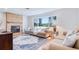 Comfortable living room with stone fireplace, hardwood floors, and natural light at 775 S Bayshore Blvd, Safety Harbor, FL 34695