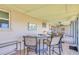 Inviting screened patio with tile flooring, a table, and chairs; perfect for enjoying the outdoors at 775 S Bayshore Blvd, Safety Harbor, FL 34695