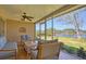 Relaxing sunroom featuring comfortable seating and scenic water views at 775 S Bayshore Blvd, Safety Harbor, FL 34695