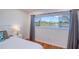 Bedroom window featuring a peaceful water view, trees, and natural light at 775 S Bayshore Blvd, Safety Harbor, FL 34695