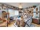Charming bedroom featuring built-in shelving filled with collectibles and cozy furniture at 117 Myrtle Ln, Plant City, FL 33565