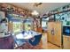 Charming dining area with a dining table, natural light, and lots of surrounding collectables at 117 Myrtle Ln, Plant City, FL 33565