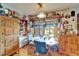 Inviting dining room featuring a dining table and lots of shelving filled with collectables and decor at 117 Myrtle Ln, Plant City, FL 33565