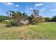 Exterior view of a single-Gathering home with a view of the lush greenery in the front yard at 117 Myrtle Ln, Plant City, FL 33565