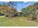 Charming home nestled in lush greenery and mature trees, creating a private and tranquil setting at 117 Myrtle Ln, Plant City, FL 33565