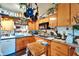 Functional kitchen featuring wooden cabinets and essential appliances at 117 Myrtle Ln, Plant City, FL 33565