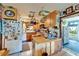 Bright and efficient kitchen with center island and ample storage and counter space at 117 Myrtle Ln, Plant City, FL 33565