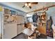 Functional kitchen area with a refrigerator, storage, and dining area that has natural light at 117 Myrtle Ln, Plant City, FL 33565