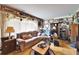 Cozy living room with a comfortable sofa and an array of decorative items at 117 Myrtle Ln, Plant City, FL 33565
