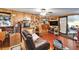 Relaxing living room with wood-paneled walls and comfortable seating arrangement at 117 Myrtle Ln, Plant City, FL 33565