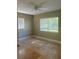 Cozy bedroom with neutral walls, tile flooring, and a large window at 1203 Durant Rd, Brandon, FL 33511