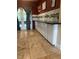 Bright kitchen featuring white cabinets, black countertop, and stainless steel appliances at 1203 Durant Rd, Brandon, FL 33511