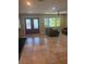 Spacious living room featuring tile floors, neutral paint, and a bright window at 1203 Durant Rd, Brandon, FL 33511