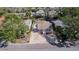 Aerial front view showing a well-maintained lawn, carport, and nearby streets at 122 10Th Ave, Indian Rocks Beach, FL 33785