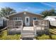 View of back deck and house featuring vinyl siding and white trim offering a relaxing outdoor retreat at 122 10Th Ave, Indian Rocks Beach, FL 33785