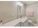 Bathroom features white vanity with sink, toilet and modern fixtures at 122 10Th Ave, Indian Rocks Beach, FL 33785