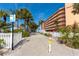 Convenient beach access walkway near the Reef Club condos with lush landscaping and clear signage for pedestrians only at 122 10Th Ave, Indian Rocks Beach, FL 33785