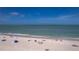 Scenic beach view with white sand and clear ocean water at 122 10Th Ave, Indian Rocks Beach, FL 33785
