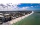 Coastal aerial view of beach with cityscape and oceanfront at 122 10Th Ave, Indian Rocks Beach, FL 33785
