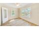Bedroom features two windows for natural light and mirror on door at 122 10Th Ave, Indian Rocks Beach, FL 33785