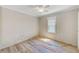 Bedroom with wood paneled walls and two windows for natural light at 122 10Th Ave, Indian Rocks Beach, FL 33785