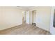Bedroom features wood floors and access to closet for storage at 122 10Th Ave, Indian Rocks Beach, FL 33785
