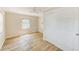 Bedroom features wood floors, window and closet for storage at 122 10Th Ave, Indian Rocks Beach, FL 33785
