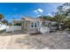 Charming single-story home with a carport, well-maintained lawn, and a welcoming front porch at 122 10Th Ave, Indian Rocks Beach, FL 33785