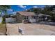 Charming single-story home with a well-manicured yard and a welcoming carport at 122 10Th Ave, Indian Rocks Beach, FL 33785