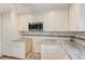 Close-up of stylish kitchen with stainless steel microwave and backsplash at 122 10Th Ave, Indian Rocks Beach, FL 33785