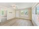 Bright living room featuring wood-look flooring and natural light at 122 10Th Ave, Indian Rocks Beach, FL 33785
