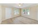 Cozy living room featuring neutral walls, new flooring, and bright windows at 122 10Th Ave, Indian Rocks Beach, FL 33785