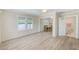 Inviting living room with views into dining room and bathroom at 122 10Th Ave, Indian Rocks Beach, FL 33785