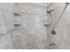 Shower features tiled walls with tiled shelving and chrome shower head at 122 10Th Ave, Indian Rocks Beach, FL 33785