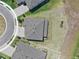 Aerial view showcasing the layout of the property with lush landscaping and neighborhood streets at 12795 Fisherville Way, Riverview, FL 33579