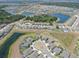 Wide aerial view showing the neighborhood's layout with multiple ponds and green spaces at 12795 Fisherville Way, Riverview, FL 33579