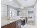 Elegant bathroom with dual vanities, granite countertops, and views into other rooms at 12795 Fisherville Way, Riverview, FL 33579
