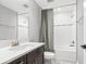 Bathroom featuring vanity with marble countertop, stylish curtain, and showerhead at 12795 Fisherville Way, Riverview, FL 33579