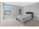 Bright bedroom with neutral walls and carpet, featuring two windows for ample natural light at 12795 Fisherville Way, Riverview, FL 33579