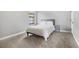 Cozy bedroom featuring a comfortable bed, carpet flooring, and a window bringing in natural light at 12795 Fisherville Way, Riverview, FL 33579