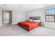 Spacious bedroom featuring gray walls, carpet, and a large window for natural light at 12795 Fisherville Way, Riverview, FL 33579