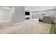 Spacious bonus room featuring neutral walls, carpet, mounted TV, and plenty of natural light at 12795 Fisherville Way, Riverview, FL 33579