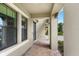 Inviting front porch features brick flooring and ample space for relaxing or greeting guests at 12795 Fisherville Way, Riverview, FL 33579