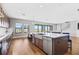 Spacious kitchen featuring an island with bar seating and a large window overlooking the yard at 12795 Fisherville Way, Riverview, FL 33579