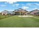 Goddard School's exterior view, featuring well-manicured lawns, a secure fence, and a welcoming, -friendly facade at 12795 Fisherville Way, Riverview, FL 33579