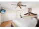 Bright bedroom with a ceiling fan and neutral decor for relaxation and personalization at 12904 Teakwood Ln, Hudson, FL 34667