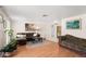 Comfortable living room showcasing hardwood floors, neutral walls, and stylish furnishings at 12904 Teakwood Ln, Hudson, FL 34667