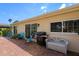 A brick-paved outdoor patio area with seating and grill, providing ample space for entertaining and relaxation at 12904 Teakwood Ln, Hudson, FL 34667